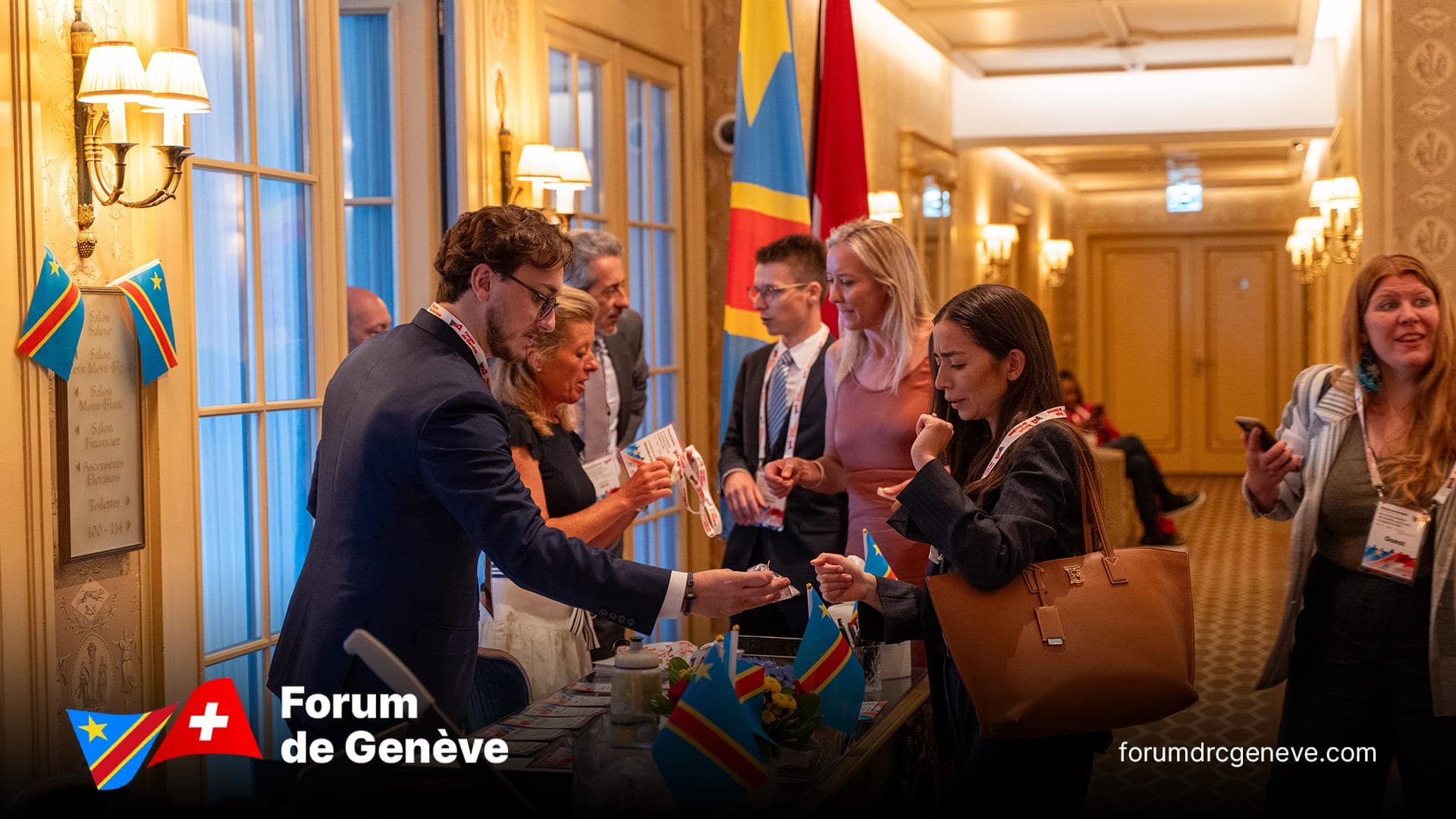 Delegates registering and receiving materials at the welcome desk, Salon Petit Mont Blanc.